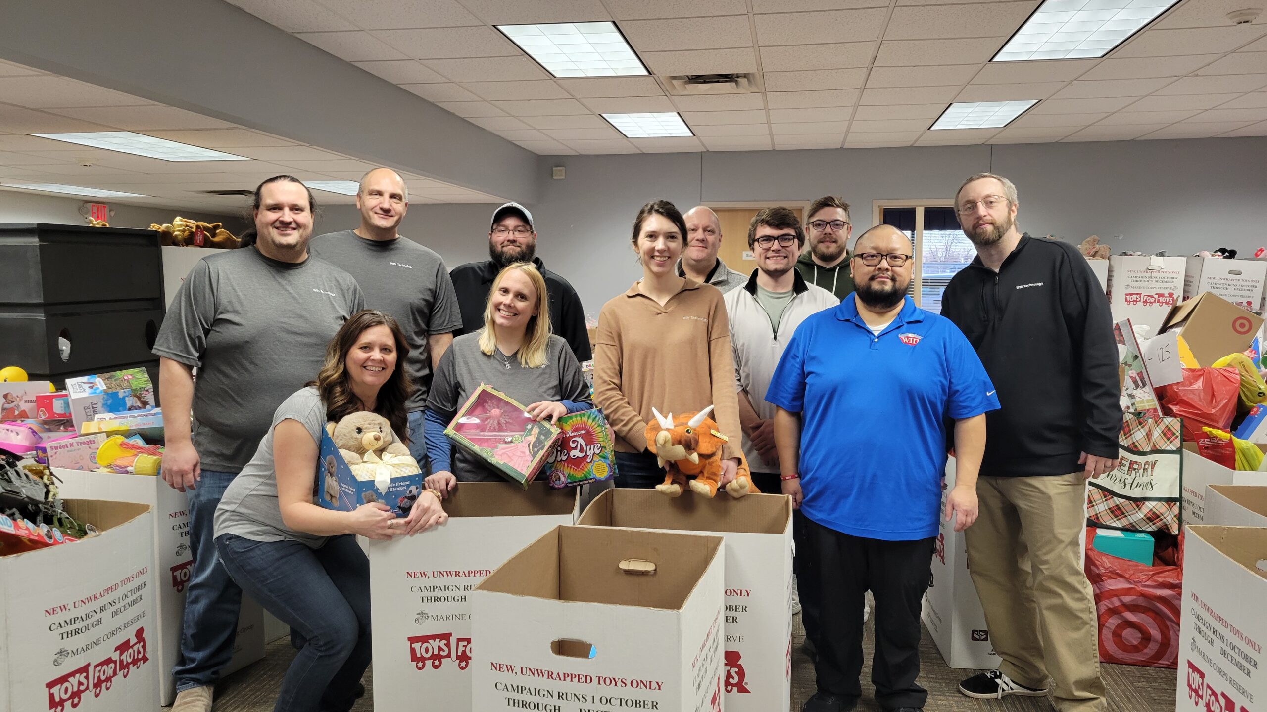 employees organizing toys at toys for tots