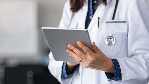 Healthcare provider working on a tablet